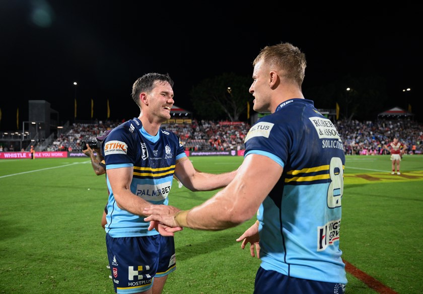 Paskins celebrates the grand final win with prop, Cooper Jenkins. Photo: Zain Mohammed/QRL