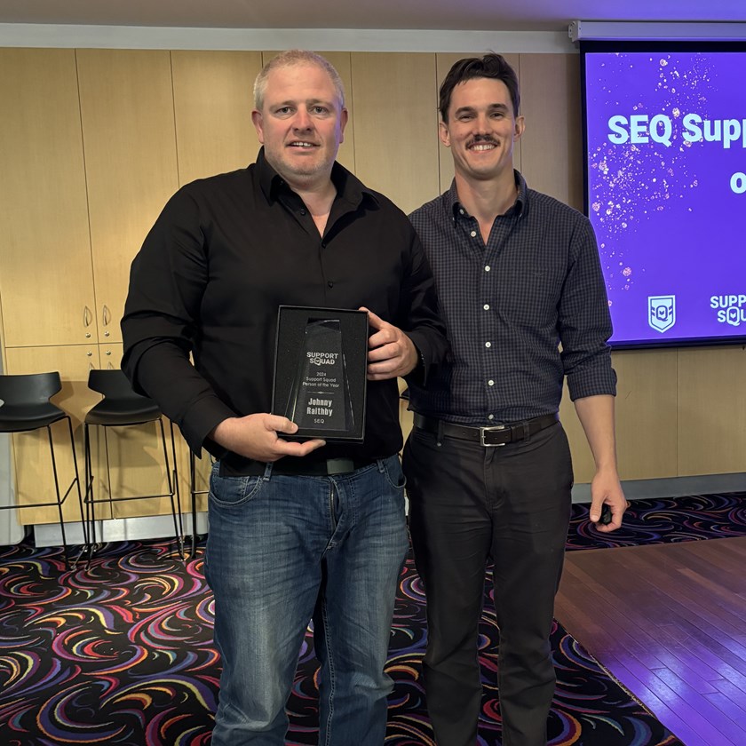 Jonny Raithby receives his award from QRL South East wellbeing and education manager Dave Sheridan.