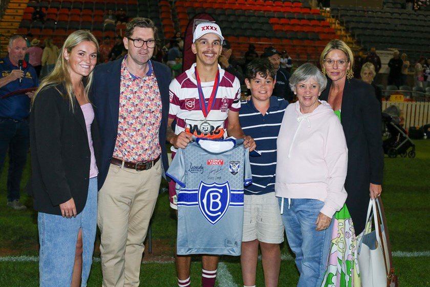 Chris Woodbridge with the McDonald family after receiving the John McDonald Medal for player of the match. Photo: Jacob Grams/QRL