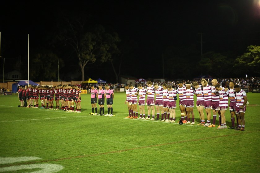 The players and crowd paid their respects to John "Cracker" McDonald prior to the A grade kickoff. Photo: Jacob Grams/QRL