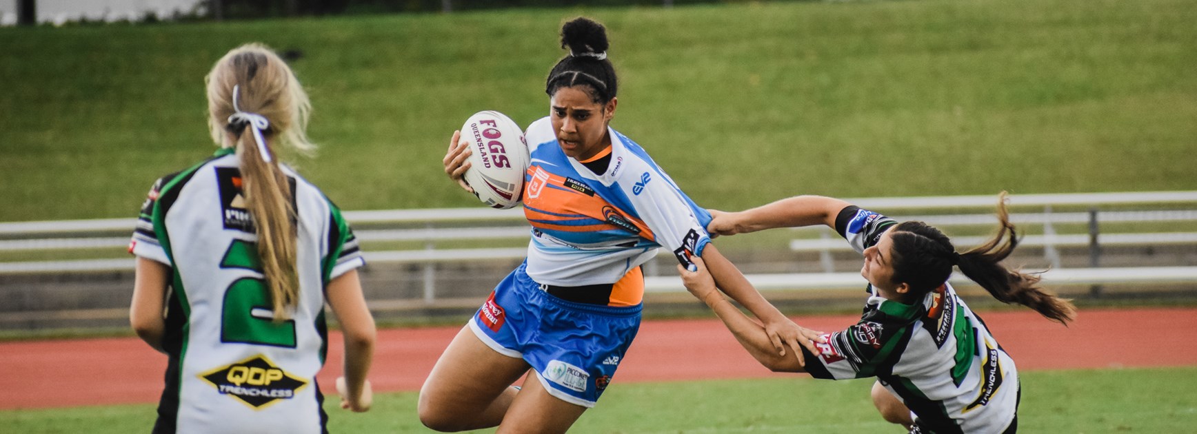 Girls display the pride of the region on the football field