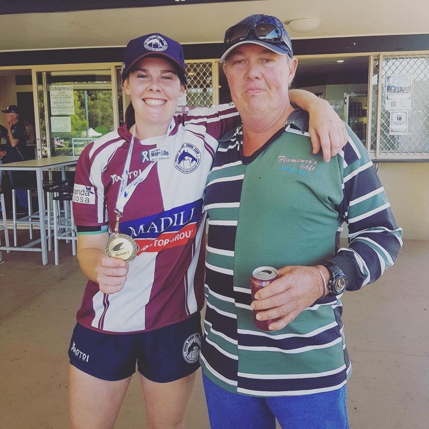 Celebrating with dad after winning the rugby union grand final last year on the Sunshine Coast. Photo: submitted by Kelli Dunlop