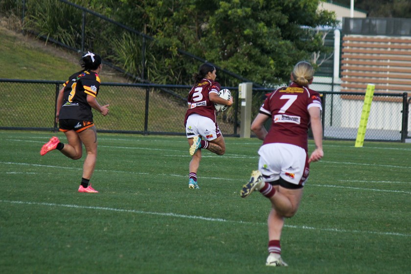 Suvanah Connors races away to the try line after an intercept. Photo: Jacob Grams/QRL