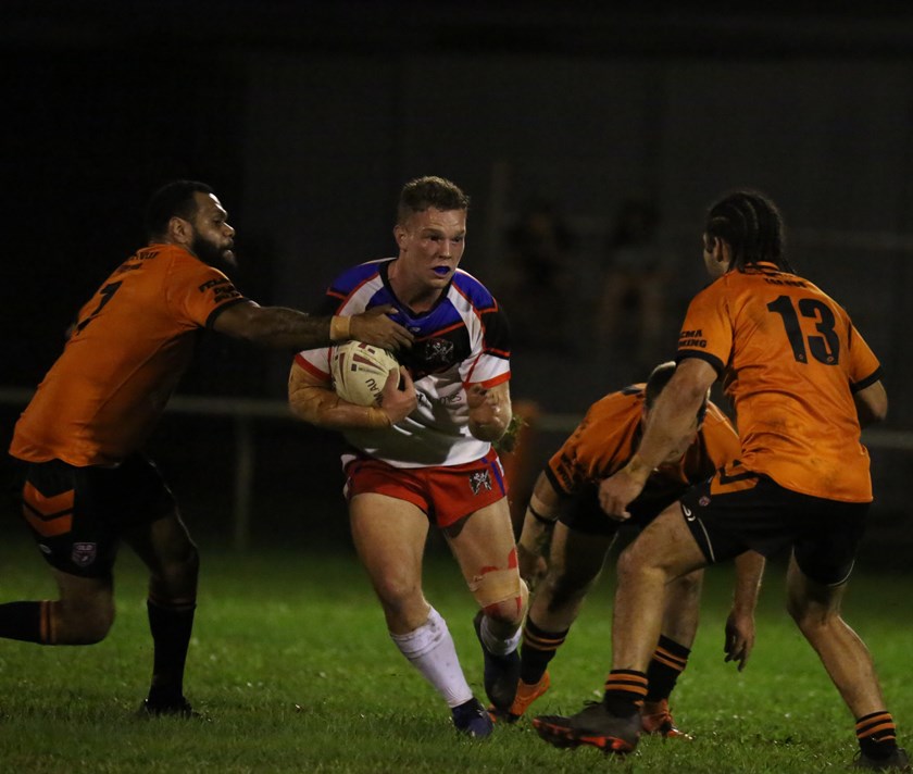 Ivanhoes first try scorer Dallas Skardon looks for space to run up the middle of the Tully defence Photo: Maria Girgenti