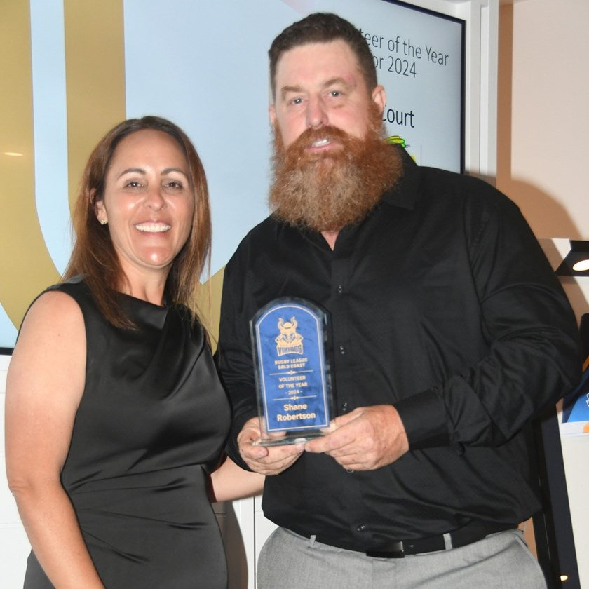 Ormeau Shearers president Shane Robertson (right) receives his Rugby League Gold Coast 2024 Volunteer of the Year award from QRL Gold Coast area manager Katie McAllister. 