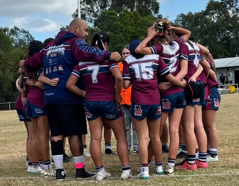 Will Tafengatoto with the under 13 girls team he coached to a grand final this year.