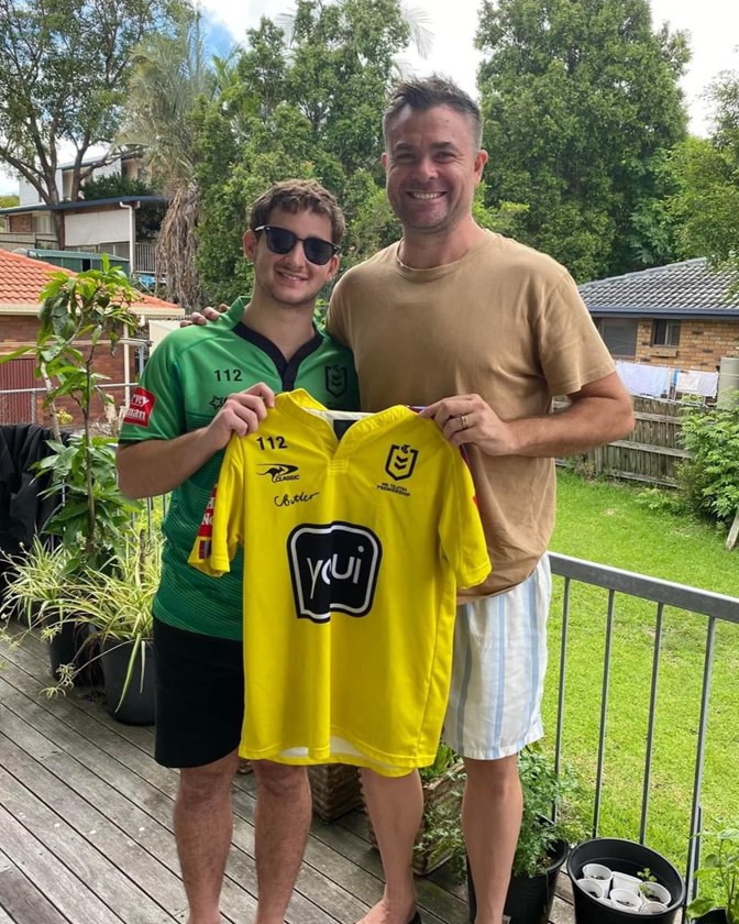 NRL referee Chris Butler (right) handing over a signed shirt in support of Josh.