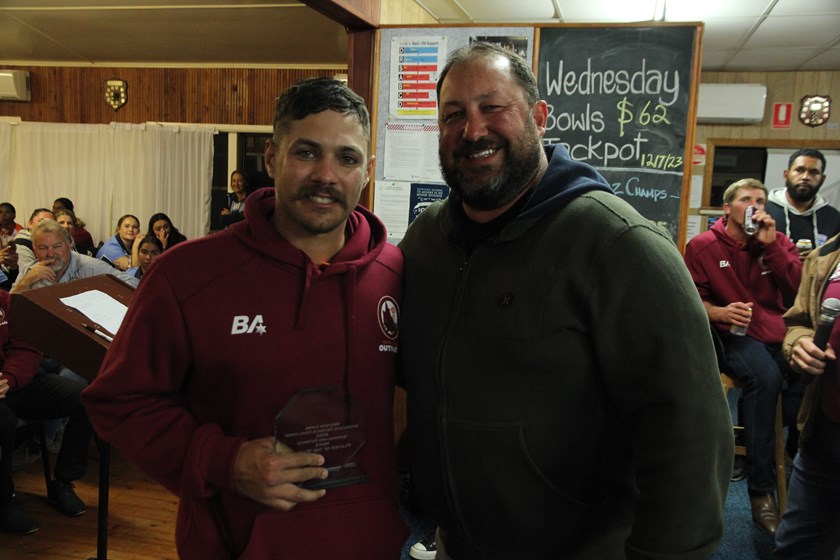 Christian Beetson (right) presenting the player of the match award