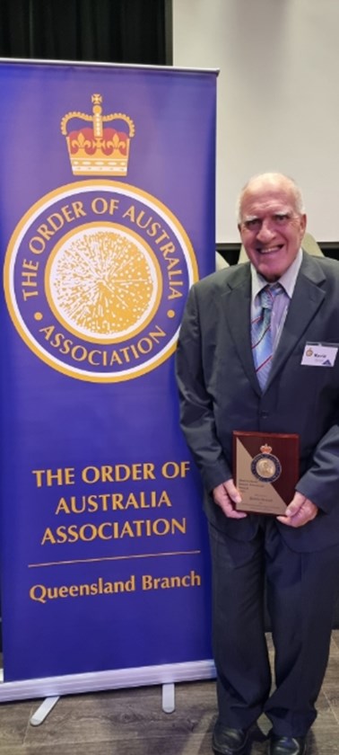 Kevin Stroud with his award from the Order of Australia Assocation.